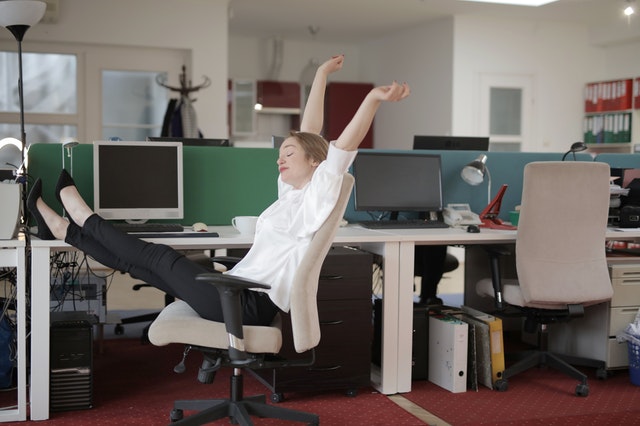 A woman is taking a break while reading or working 